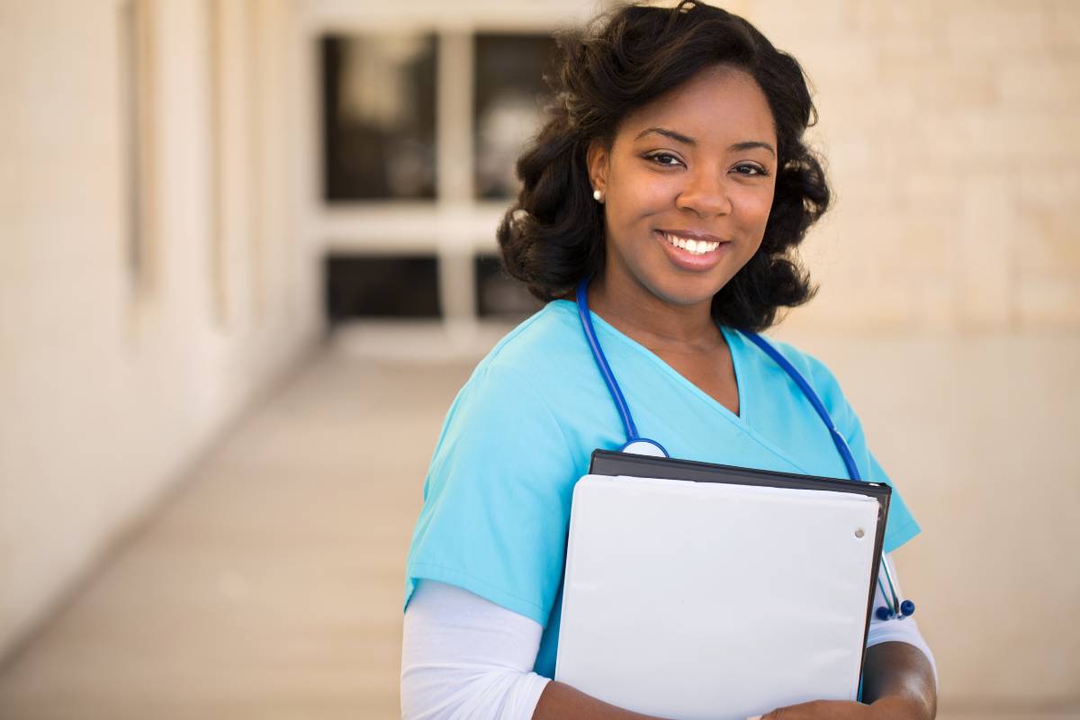 A nurse works on her DC nursing license renewal.