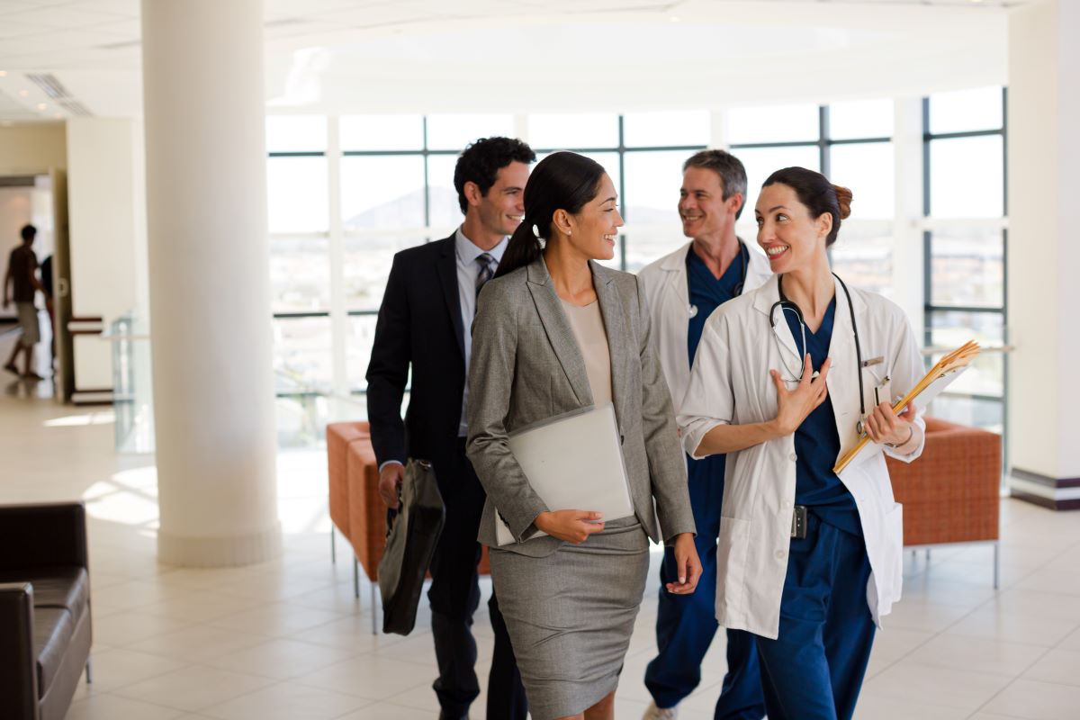 A healthcare compliance officer meets with senior hospital staff.