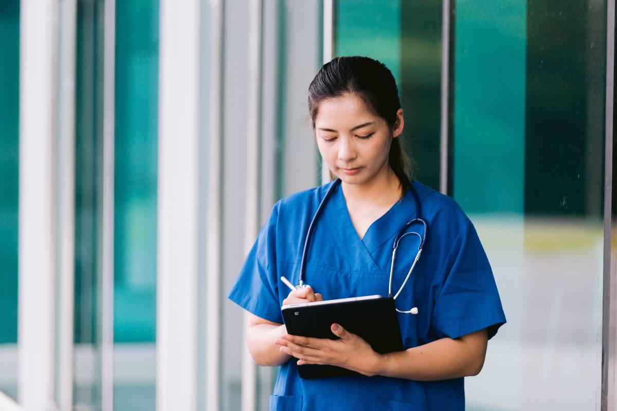 A nurse works on her KS nursing license renewal process.