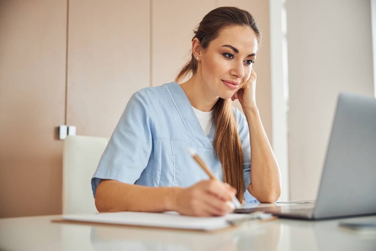 A nurse works on her Oregon nursing license renewal.