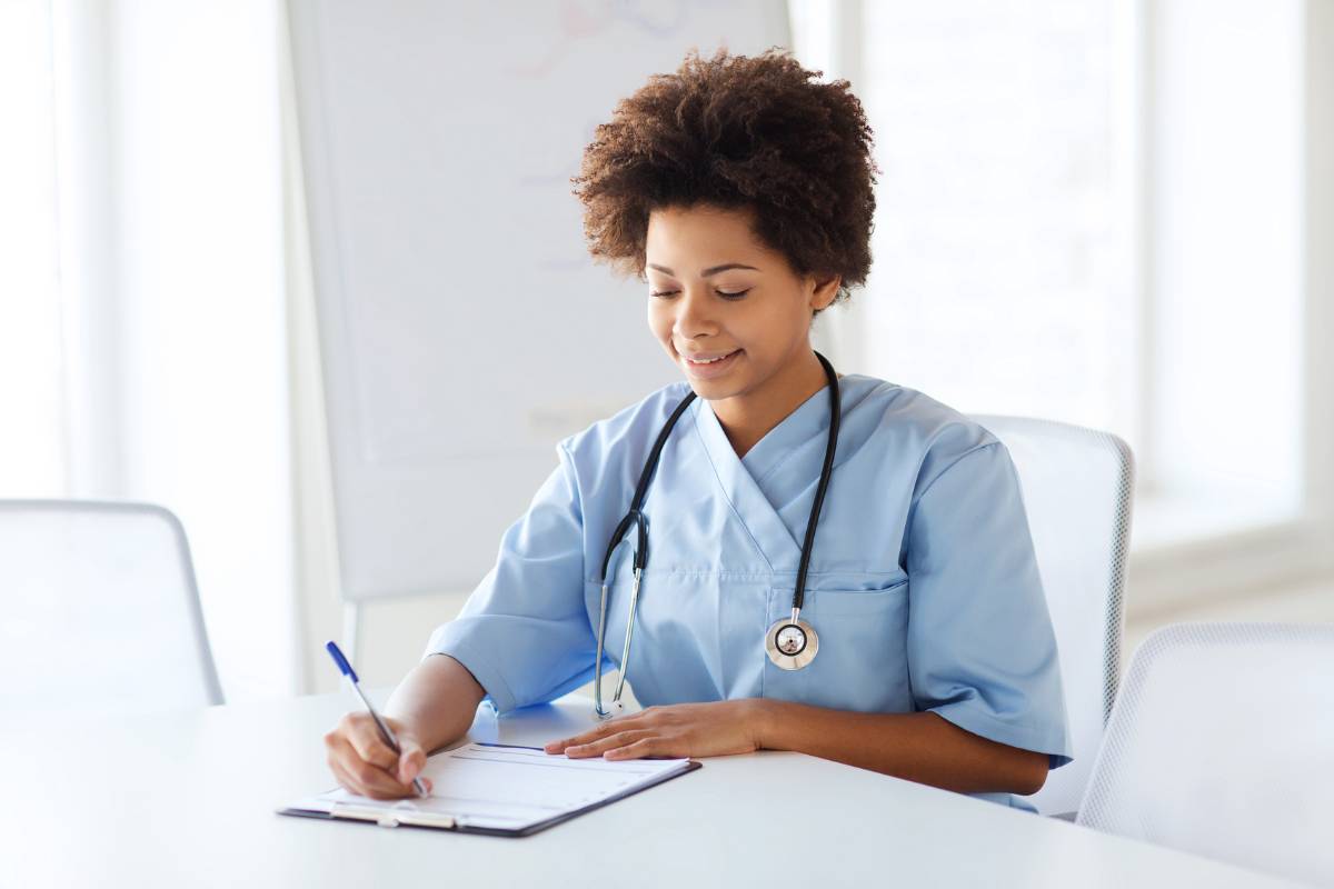 A nurse works on her RI nursing license renewal process.