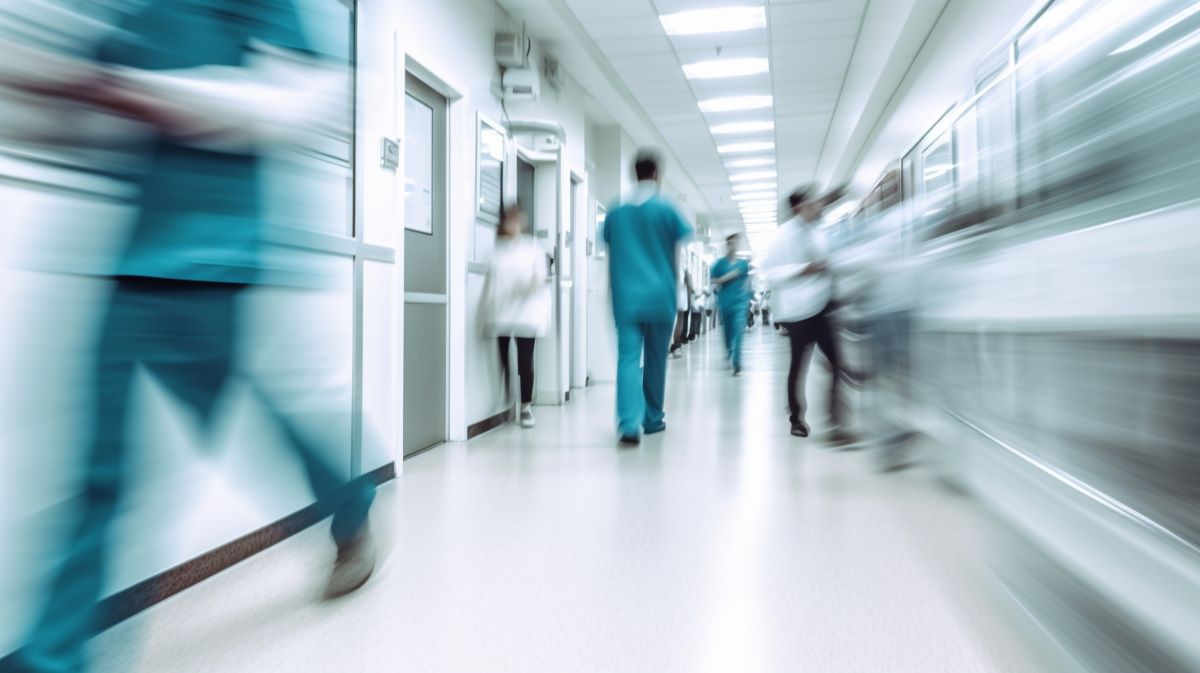 View of a busy and understaffed hospital, from the hallway.