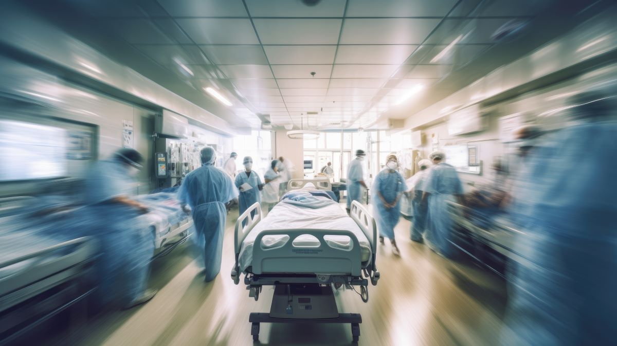 A time-elapsed photo of a busy hospital hallway.