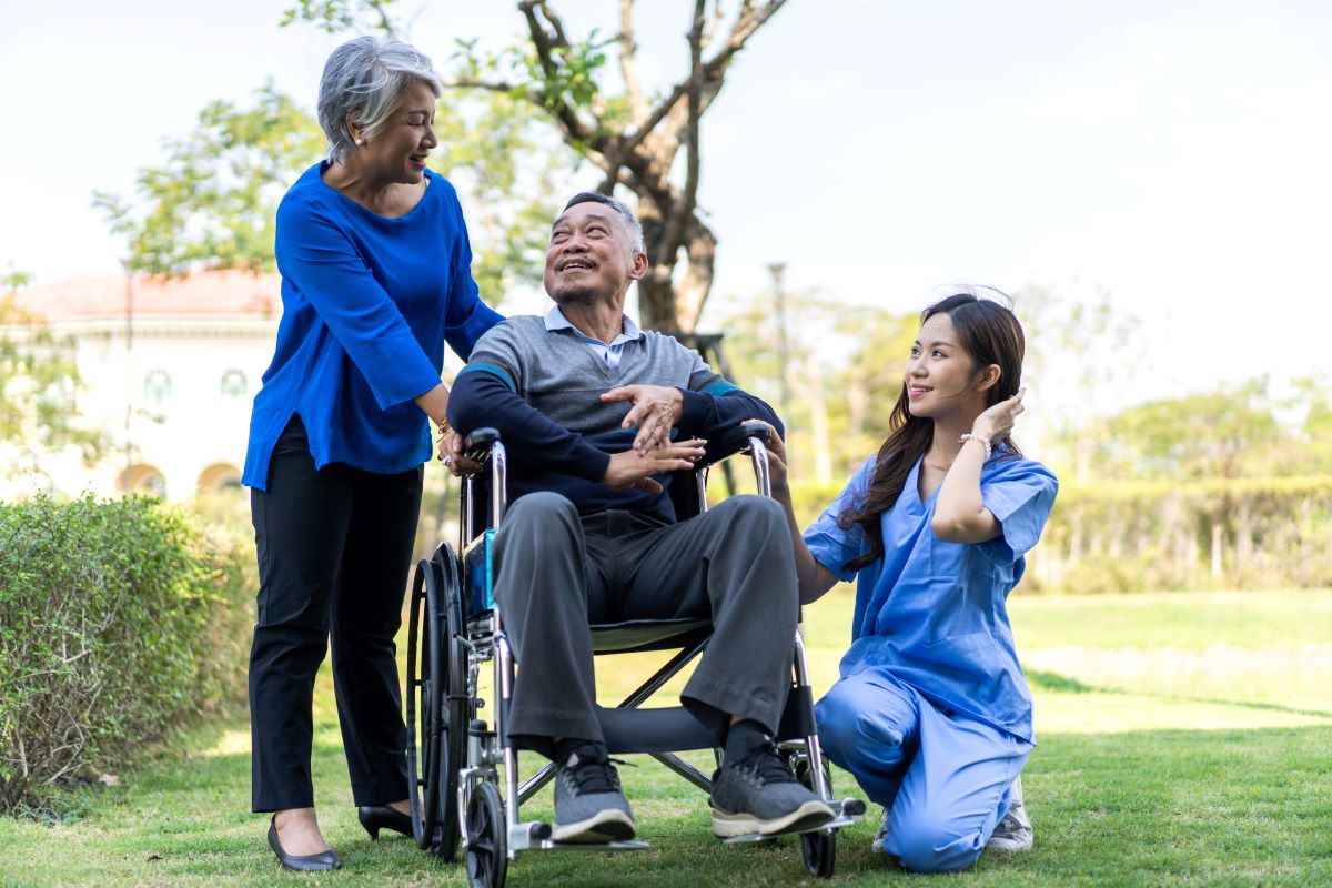 A home health aide visits a patient at his home.