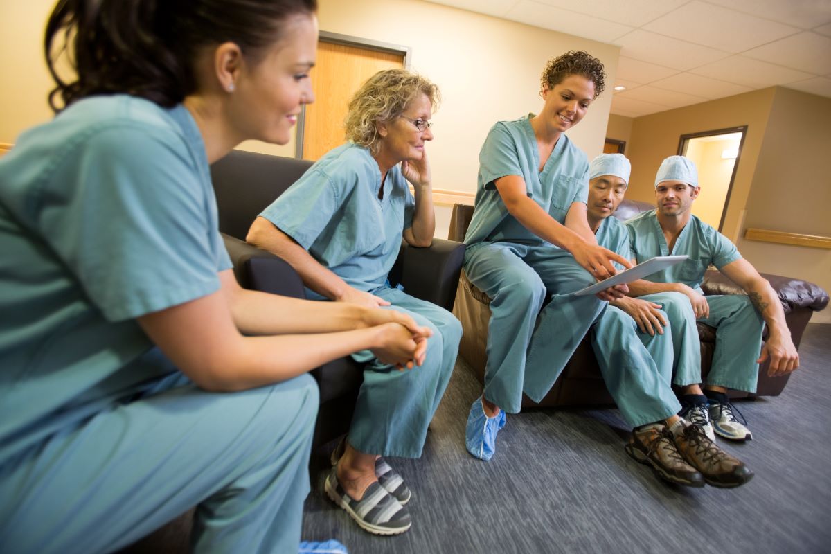 Nurses on a unit gather for a safety huddle.