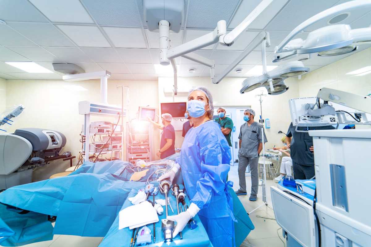 Trauma nurse in an operating room with medical team