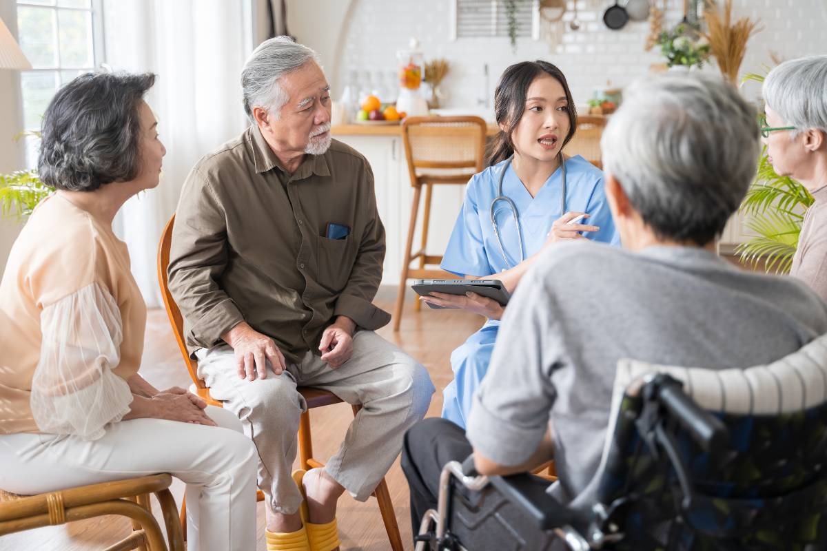 A community health nurse works with a group of patients.