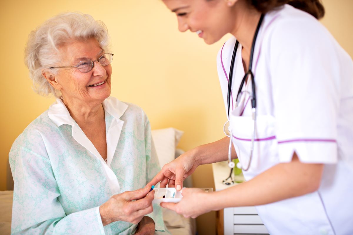 Nursing professional helping resident at a nursing facility