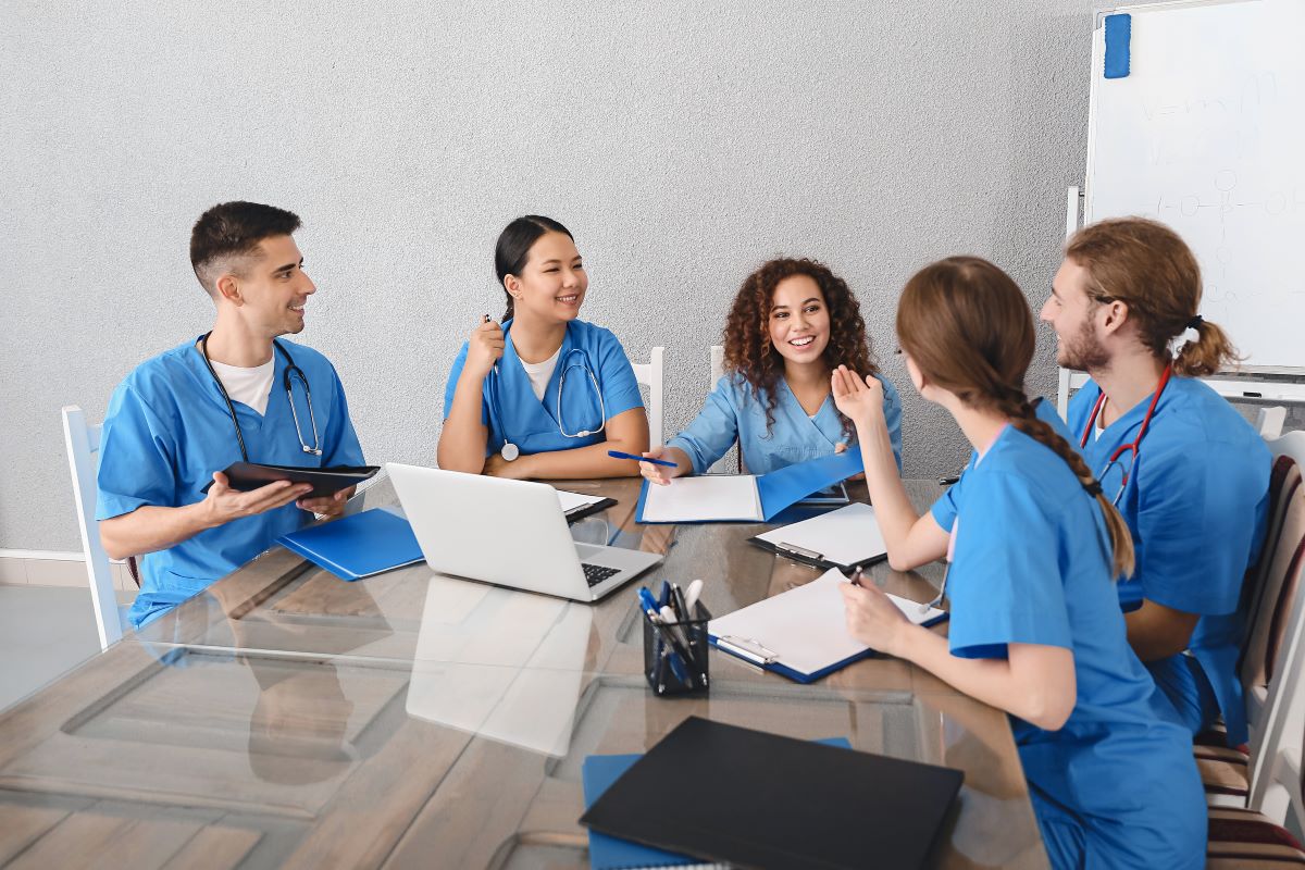 Maryland nurses sit around a conference room table.