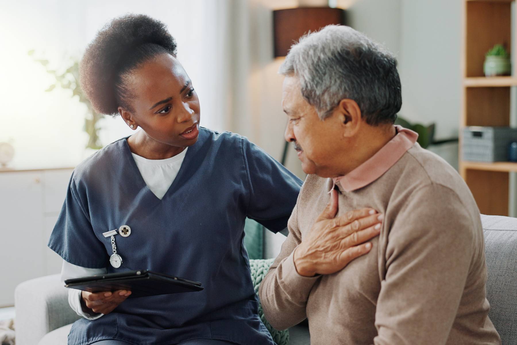 A nurse practitioner speaks with a patient about his mental health and demonstrates how to become a psychiatric nurse practitioner.