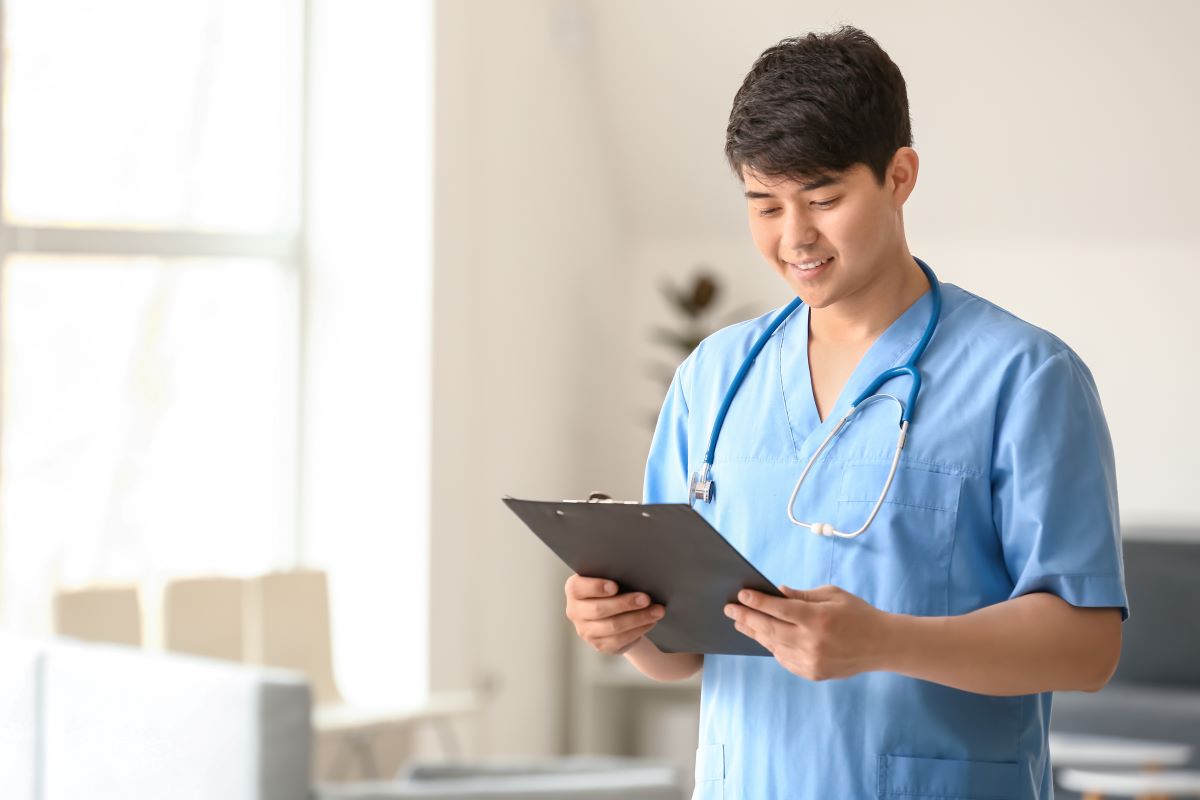 A CMA checks a patient's chart.