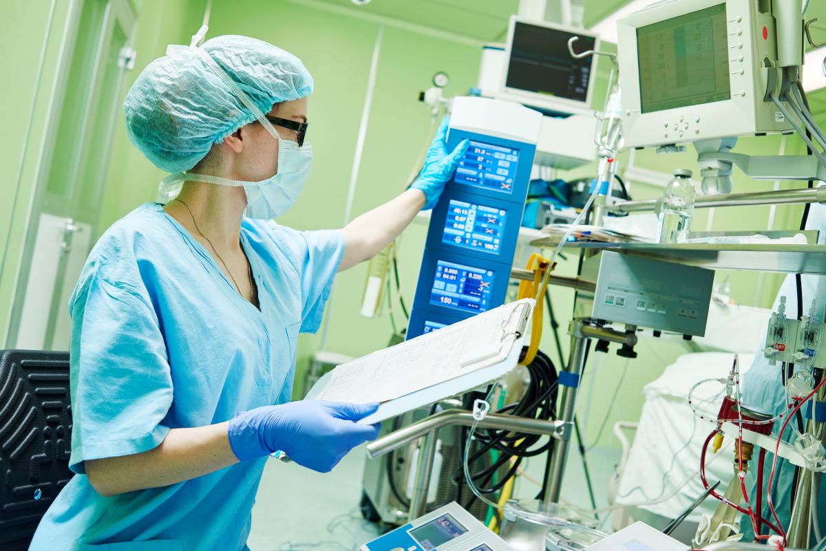 A CRNA prepares the operating room for a procedure.