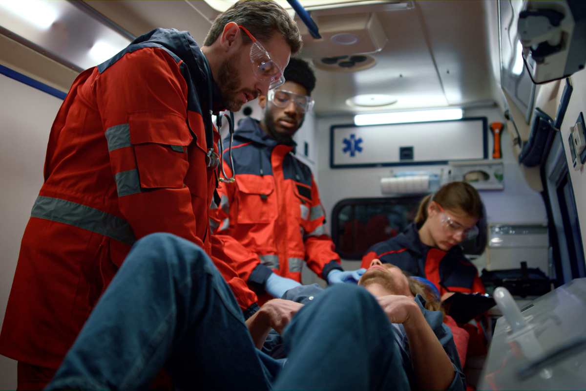 TCRN certification nurses treating a patient in a helicopter.