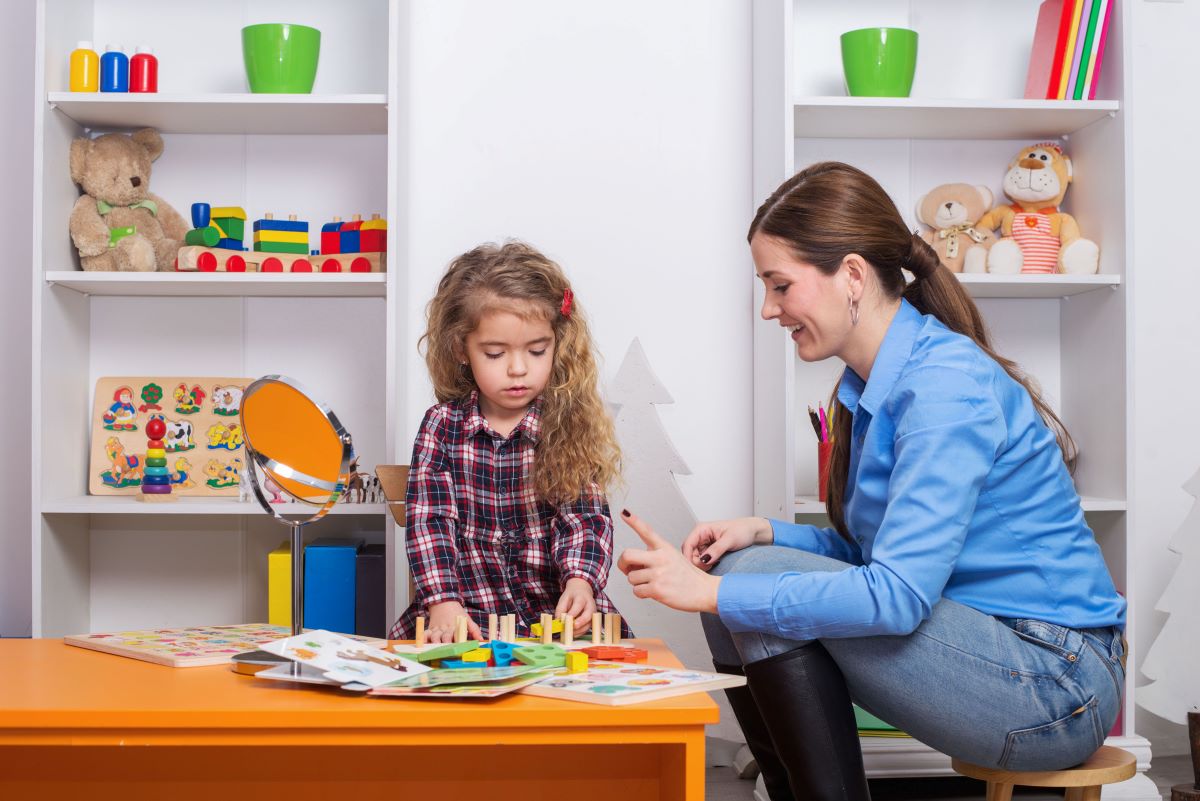 A behavioral health nurse works with one of her patients.