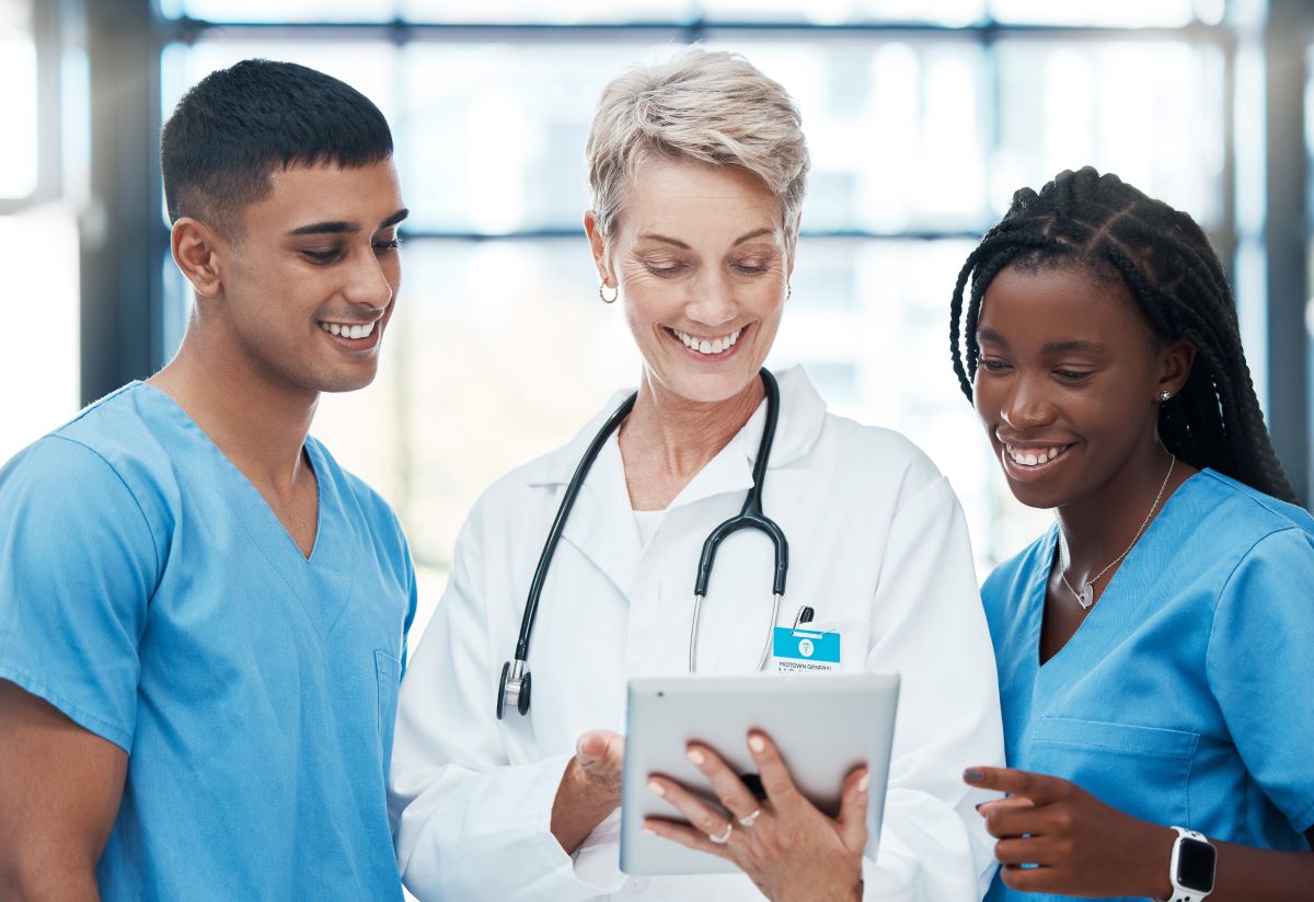 A facility's chief nursing officer talking with two of her charges.