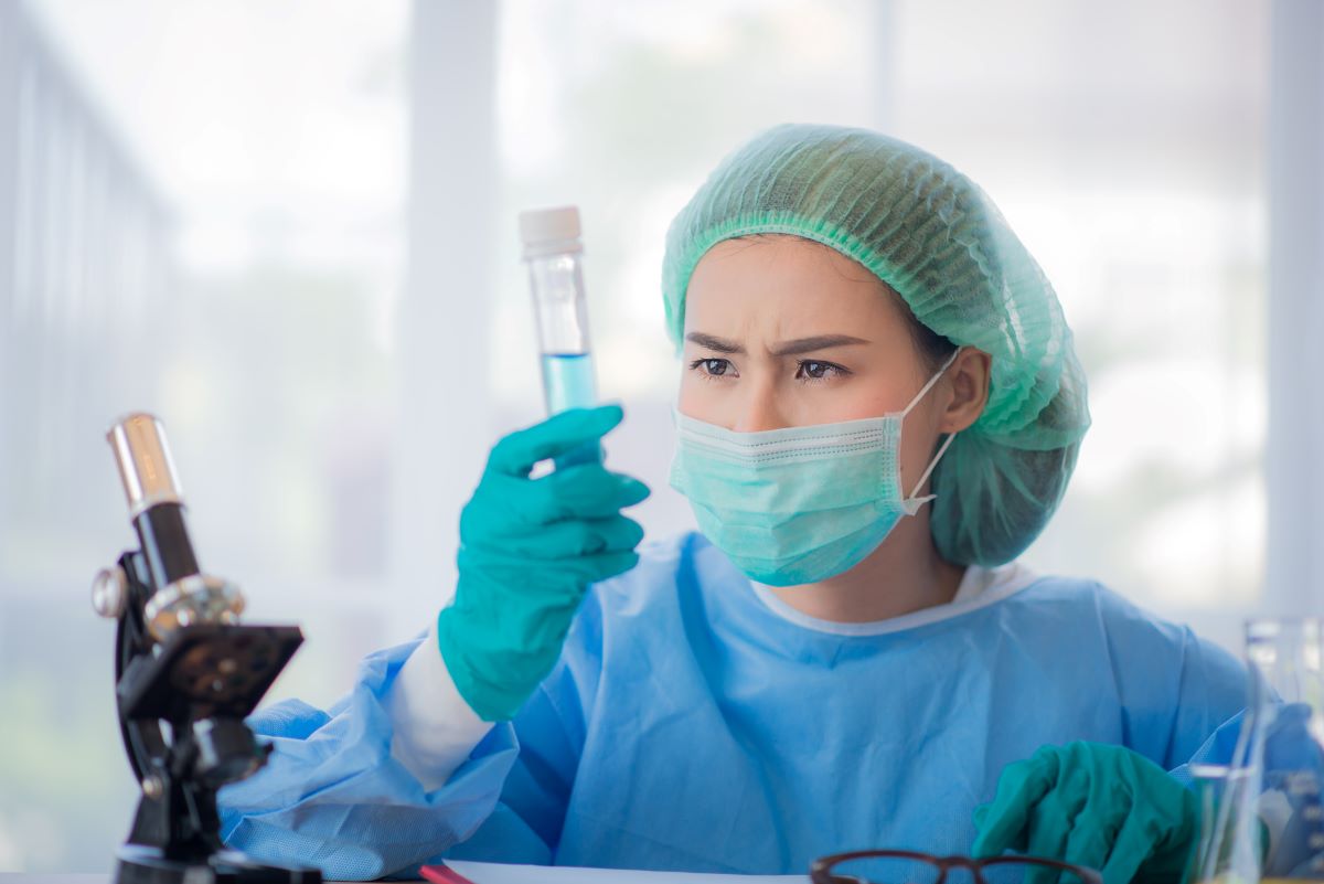 A forensic nurse tests fluids.