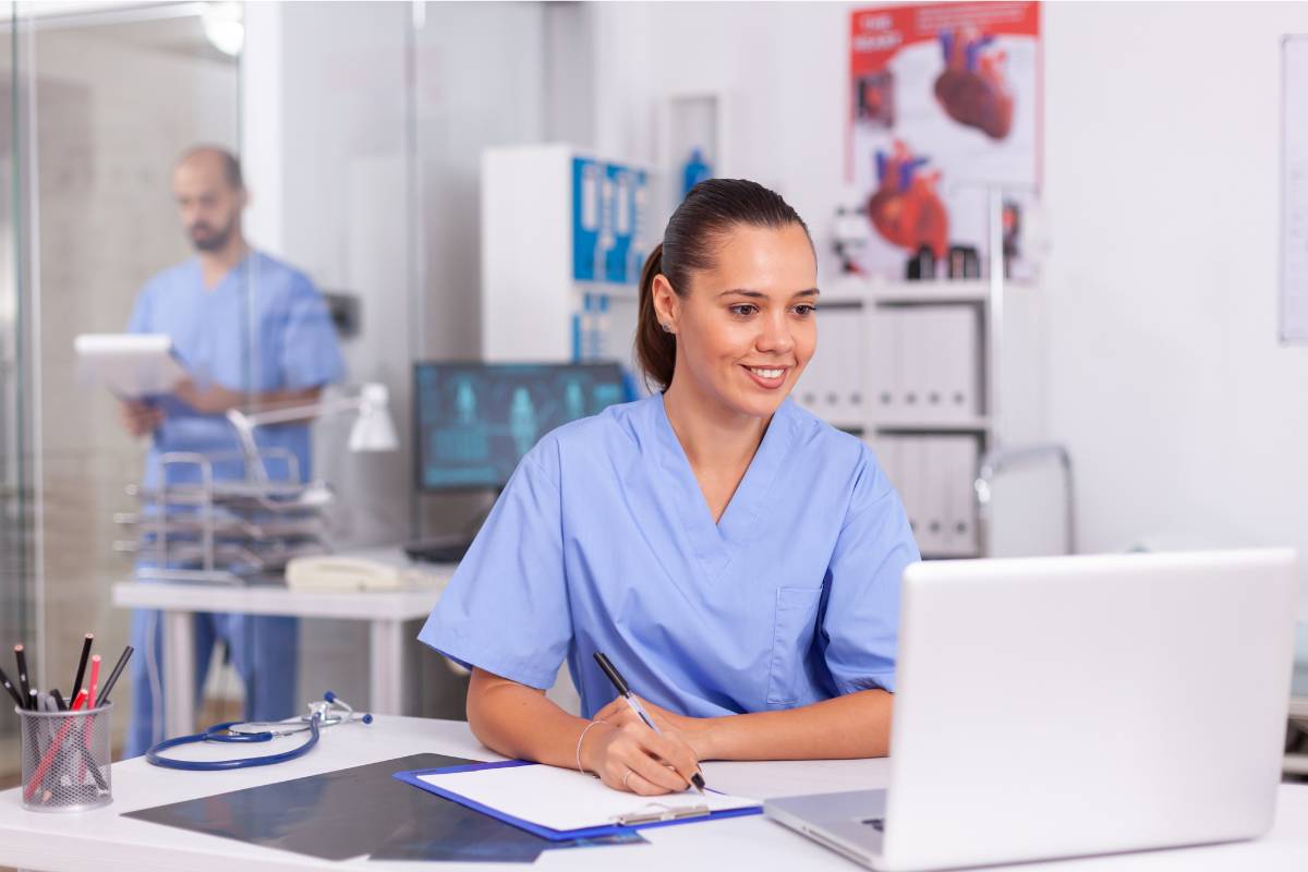 A prospective nurse works on a motivational letter for nursing school.