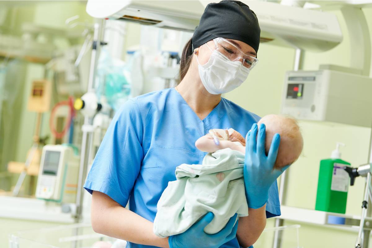 A nurse uses her RNC certification (RNC-NIC) skills in the NICU.