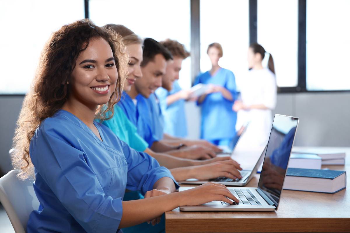 A nursing student studies Virginia Henderson nursing theory in class.