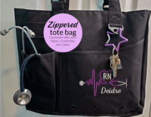 Black nursing bag with exterior compartments.