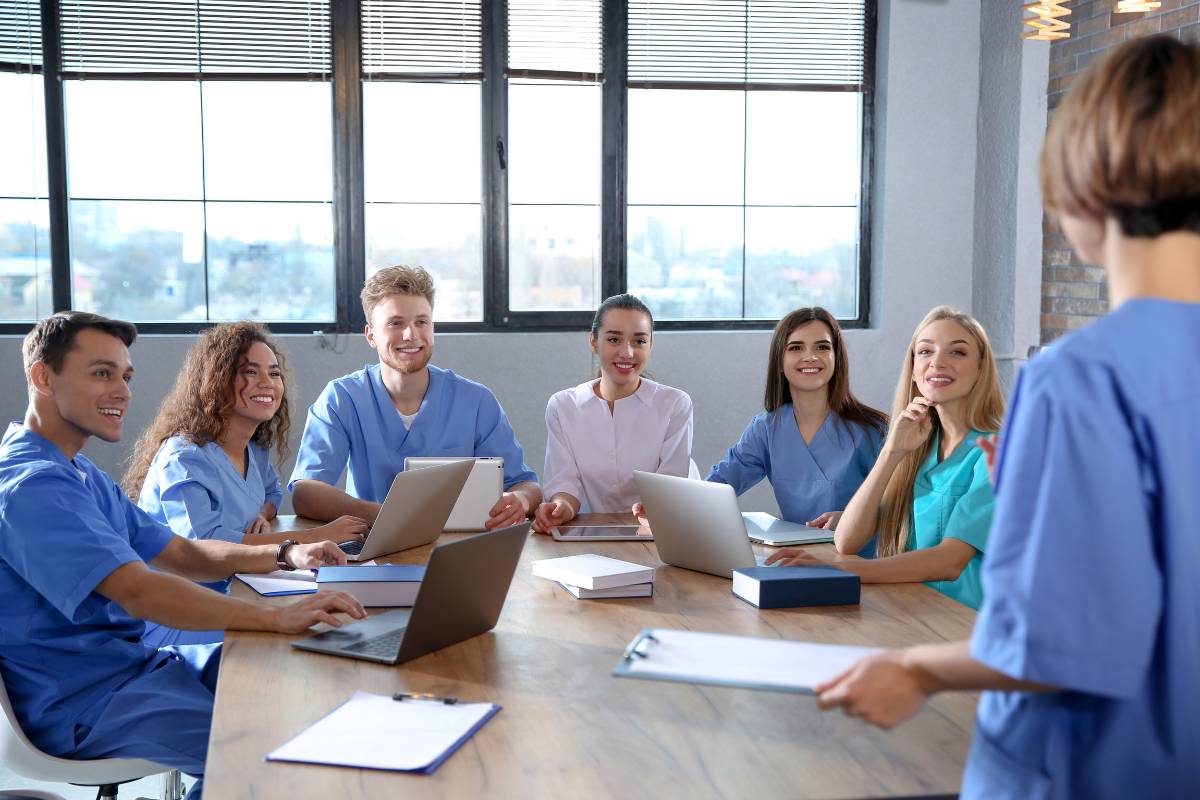 A nursing professional uses their NPD certification to instruct a group of nurses.