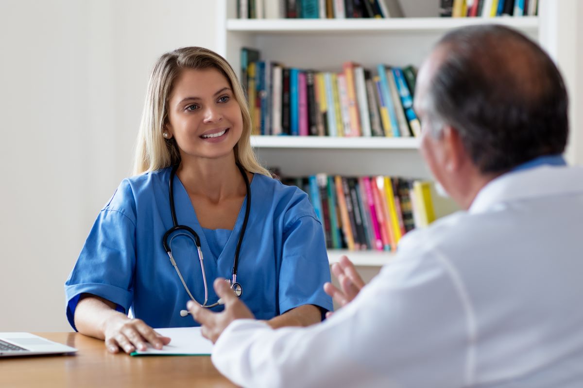 A nursing supervisor meets with one of her physician counterparts.