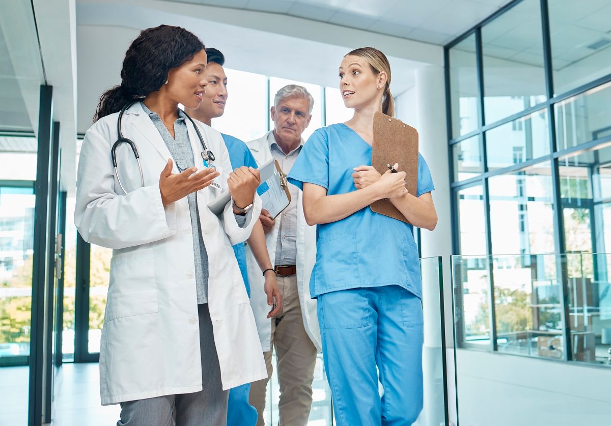 Nurses and physicians having a discussion.