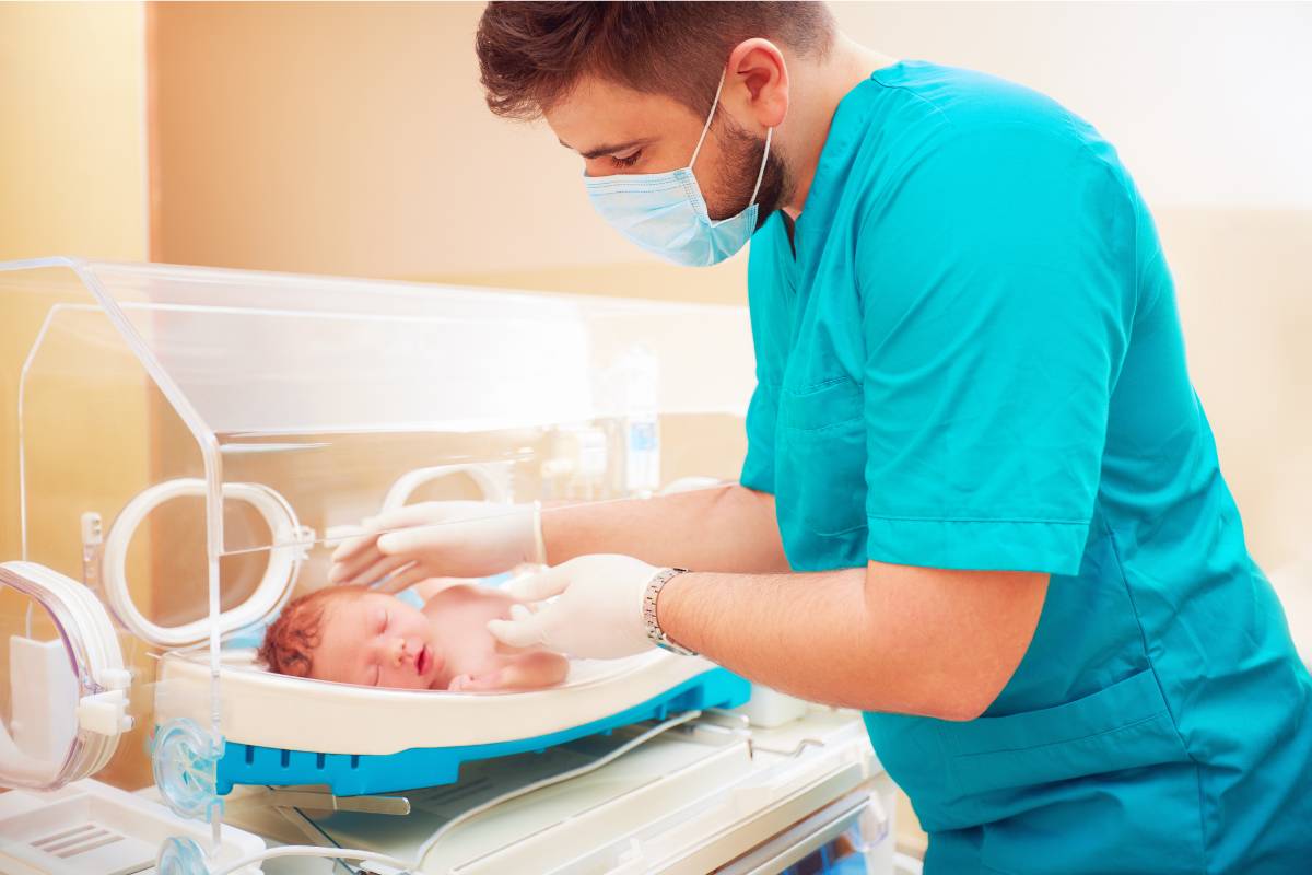 A nurse with RNC-MNN certification cares for a newborn.