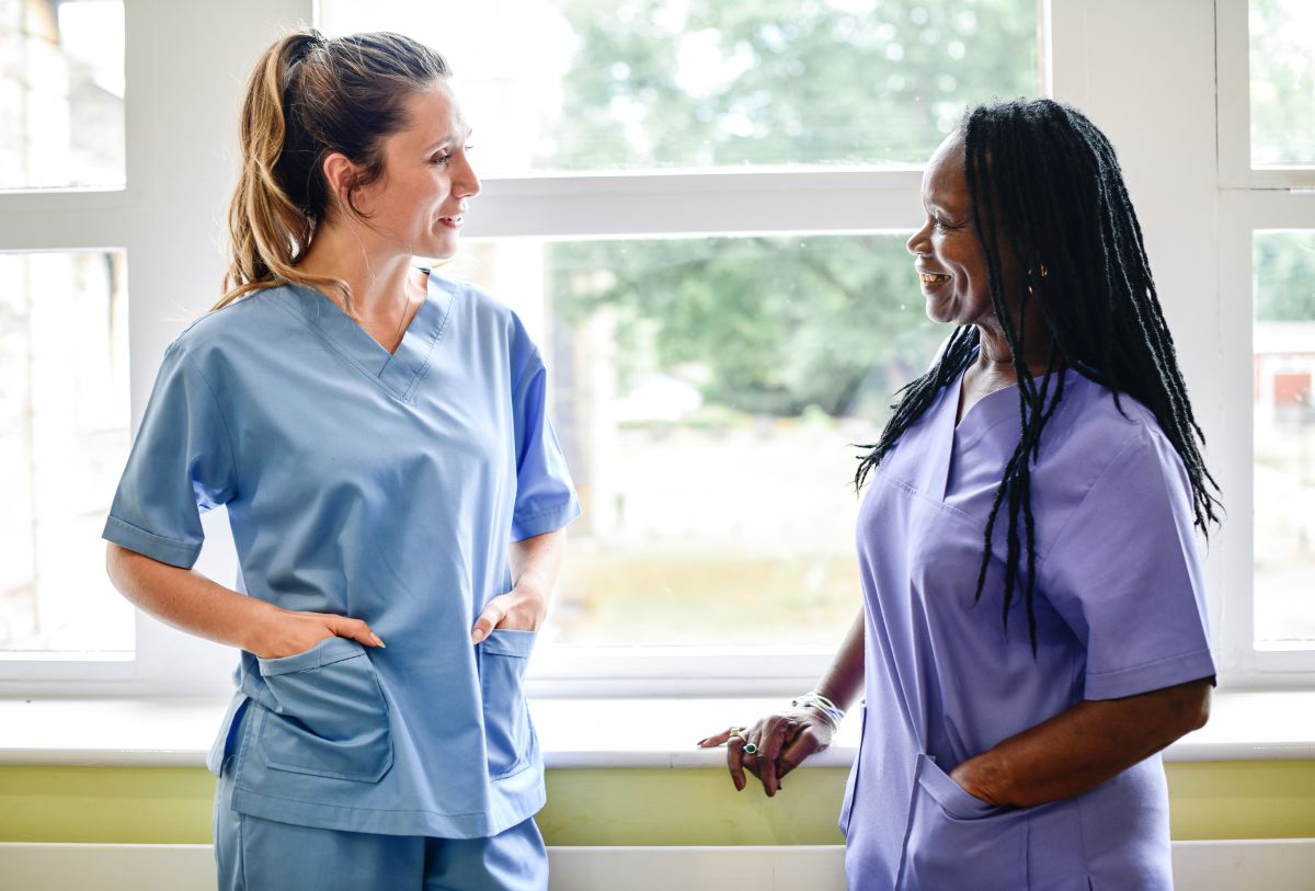 Nurses at a Utah hospital, having a discussion in the hallway.