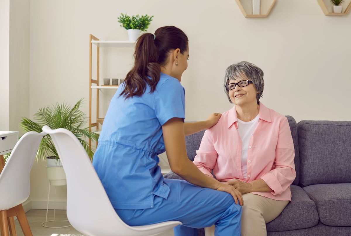 A neuro nurse consoles one of her patients.