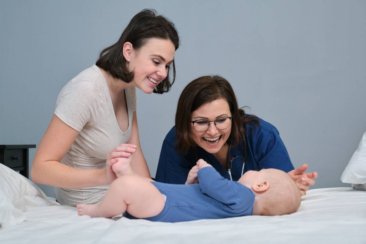 A nurse with CLC certification assists a mother and her new baby.