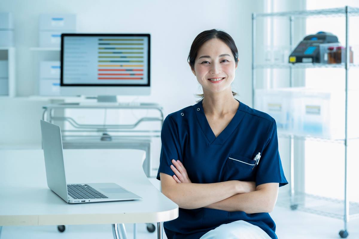 A nurse discusses fun facts about a clinical nurse specialist as she poses for a photo.