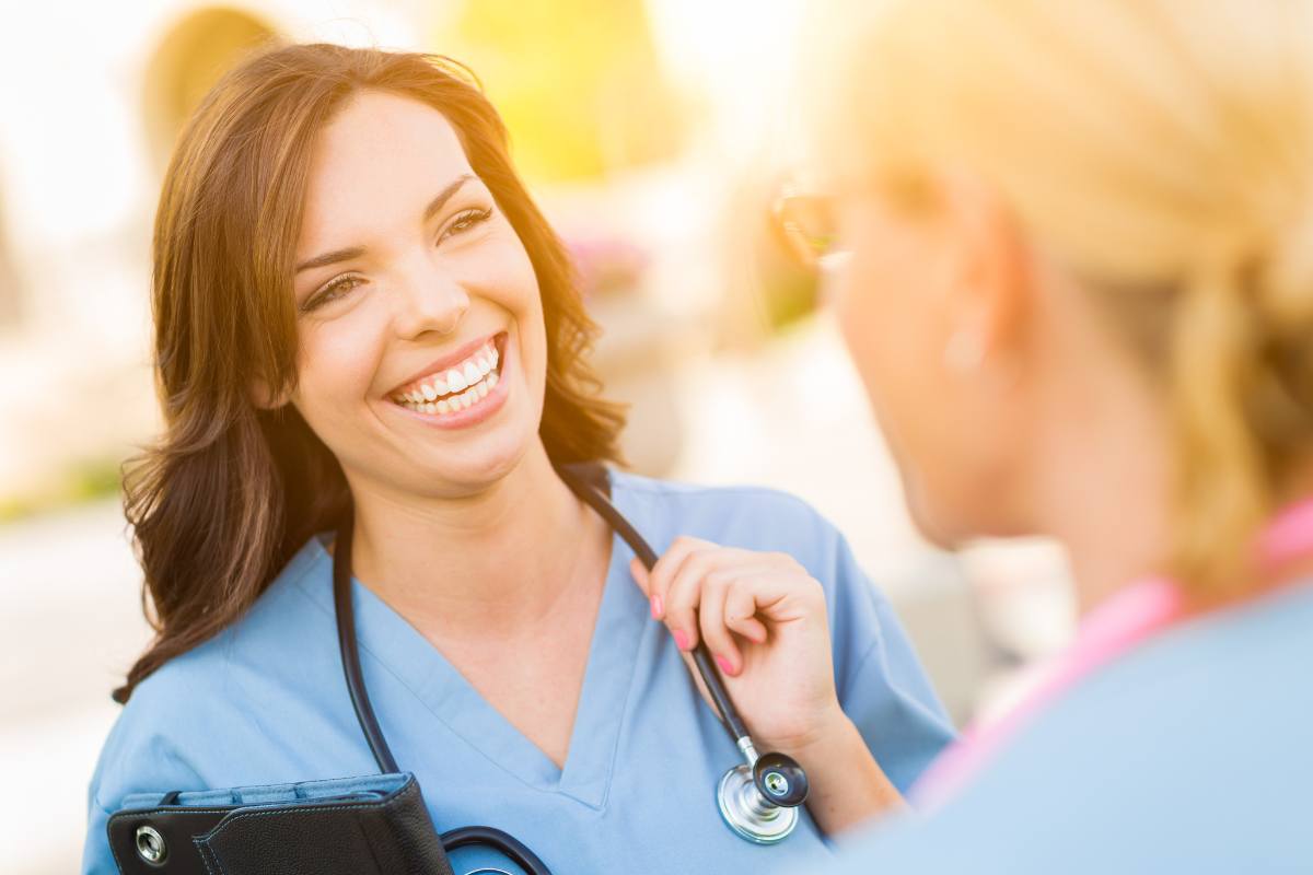 A nurse speaks with a coworker about how to become an RN in Florida.