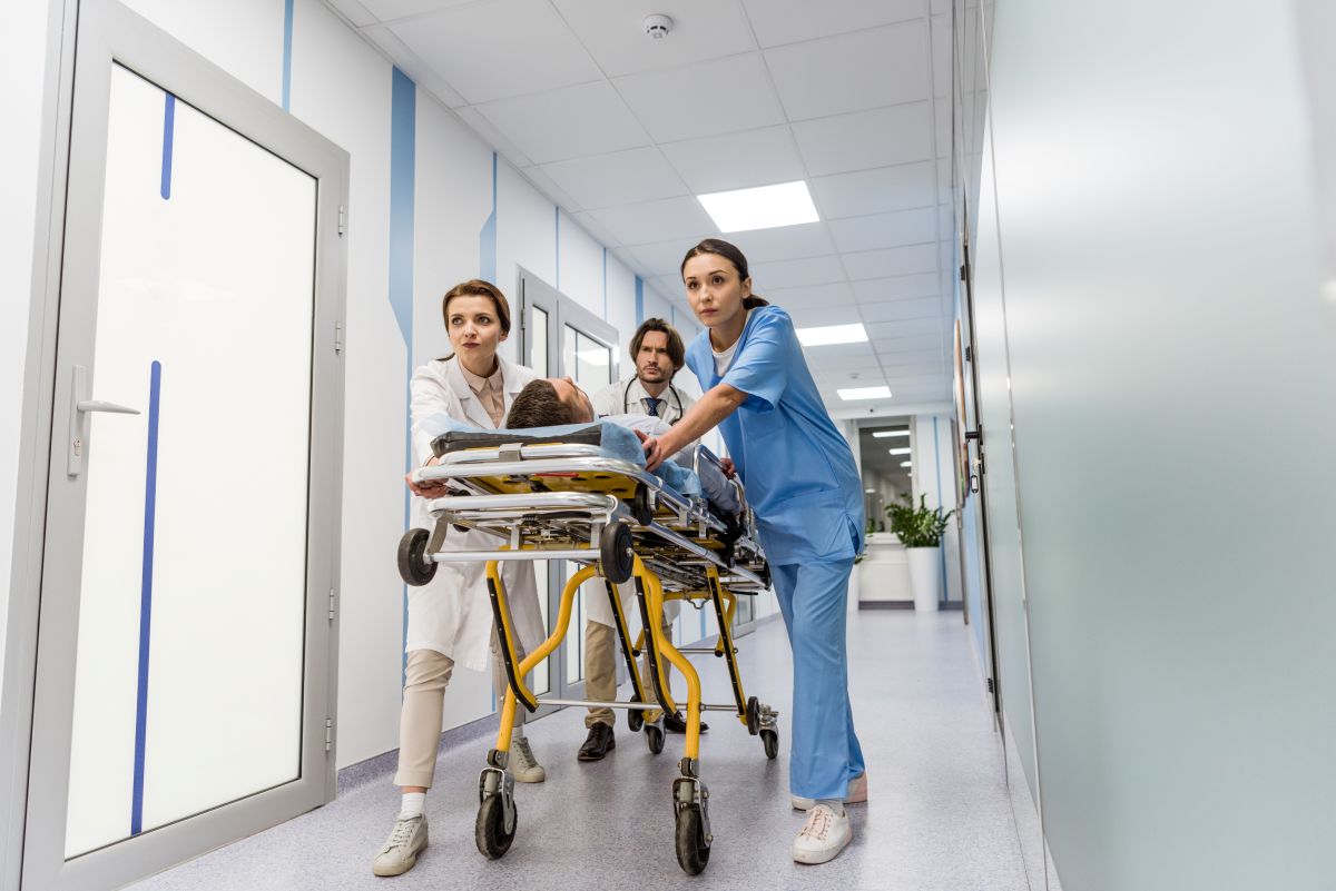 Idaho nurses transport a patient down a hospital hallway.