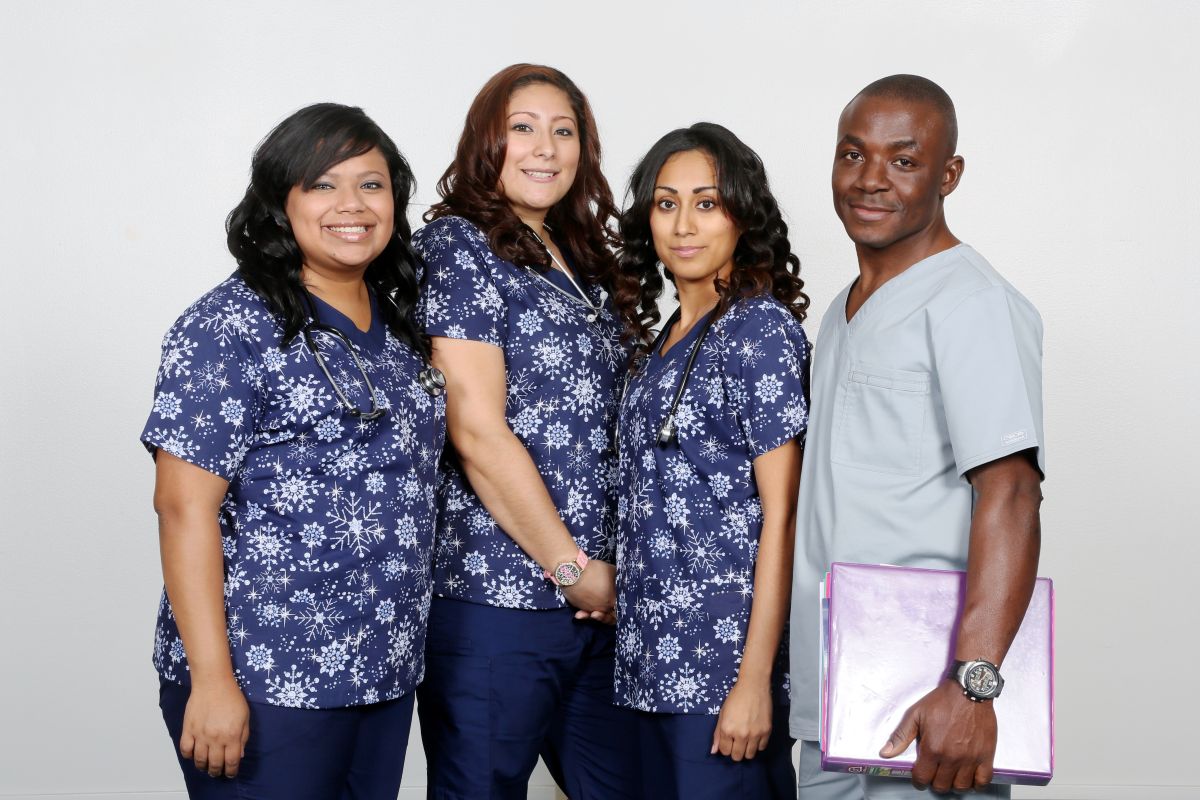 Four nurses pose for the camera.