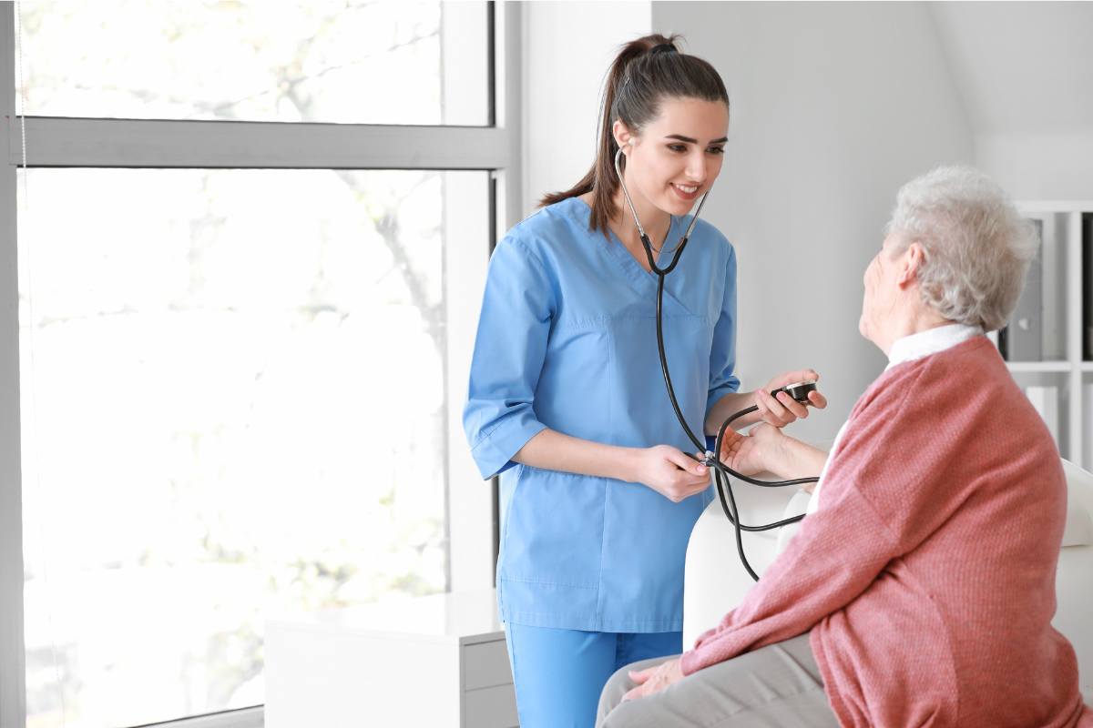 A nurse with SCRN certification assesses a patient.