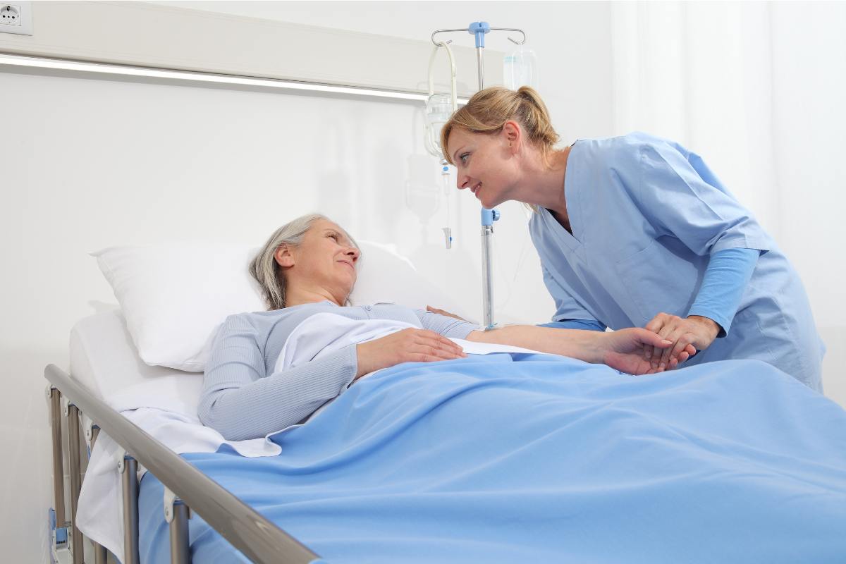 A nursing assistant demonstrates the answer to the question, What is a patient care technician?